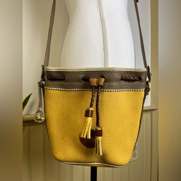 Vtg Dooney & Bourke AWL Teton Drawstring Crossbody Bucket Bag Palomino Yellow - Picture 1 of 15